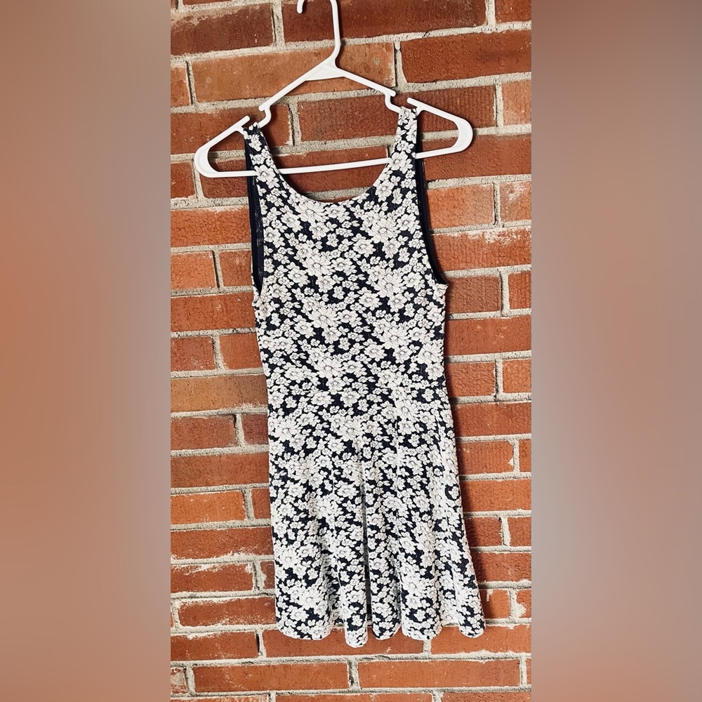 White and dark blue lacy patterned dress.